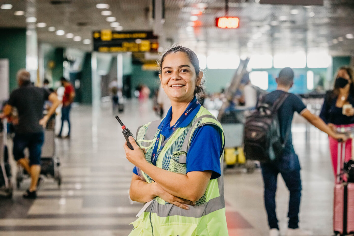 VINCI Airports employee collaborating on site at an airport, illustrating operational excellence and teamwork